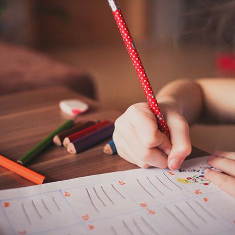 young girl writing