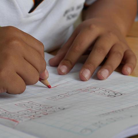 closeup of child working on math problem