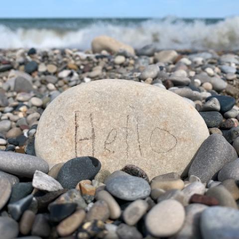 a rock with "hello" written on it