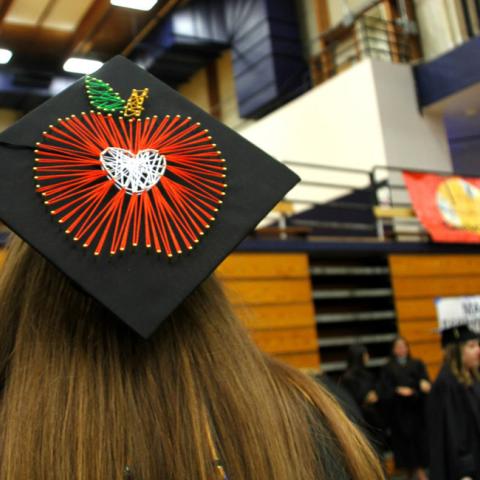 mortarboard with apple corcheted on it