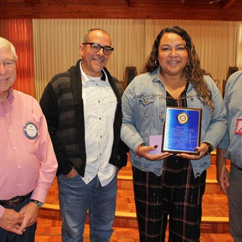 Verónica Ramos with Rotary Club member Dan Herlinger, Adelante Principal Javier Bolívar, and Rotary Club member Michael Baker