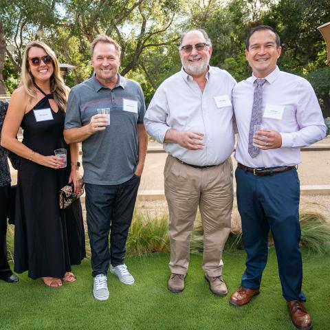 Kelly and Scott Trueman, Dean Milem, and Dr. Ty Vernon at a salon benefiting the Koegel Autism Center