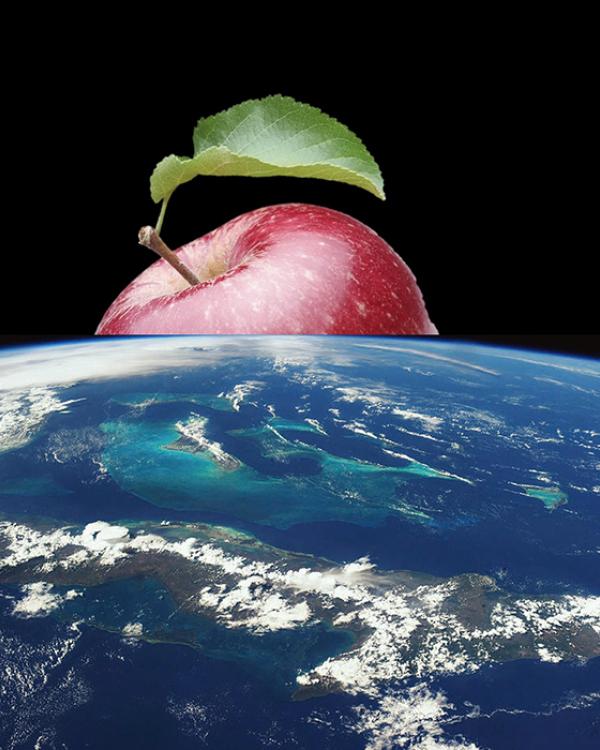 an apple rising up above the Earth from space 