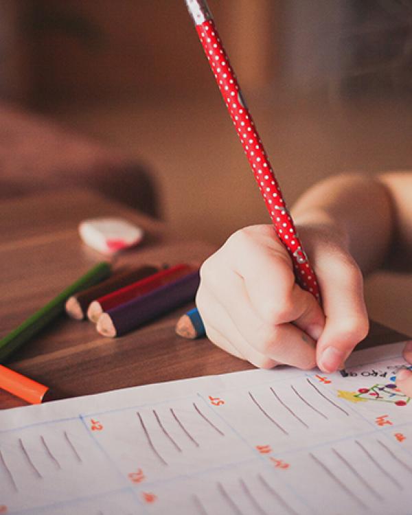 young girl writing 