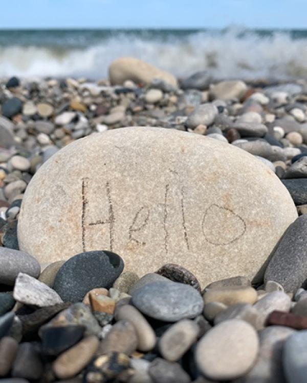 a rock with "hello" written on it 