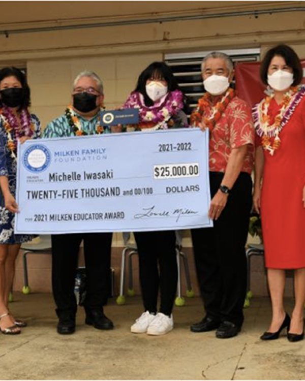 Michelle Iwasaki with prop Milken check 