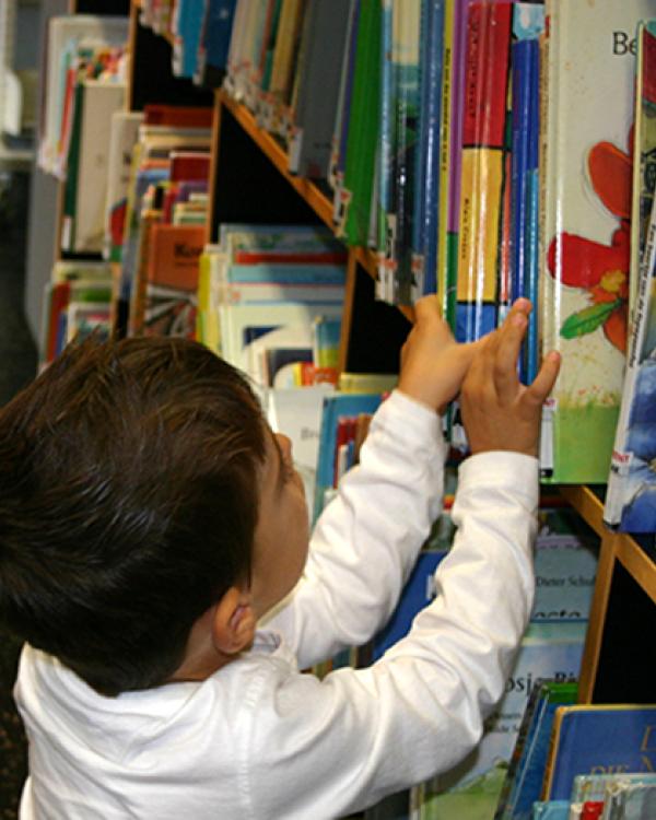 young boy in library 