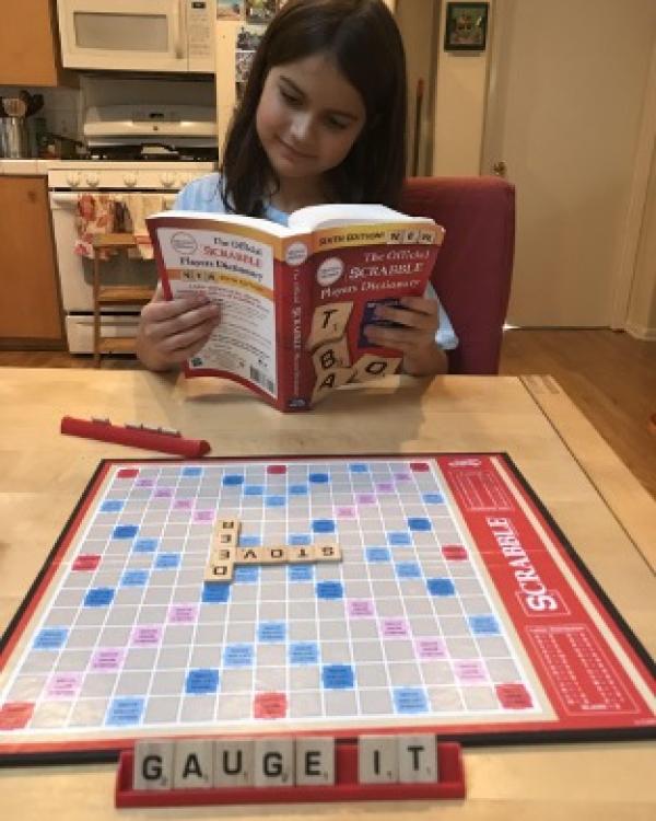 Lila Kia-Keating playing Scrabble 