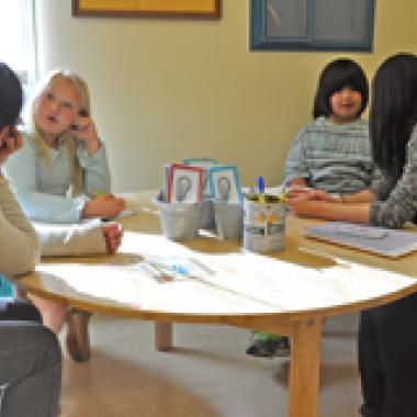 Readers and teachers at table